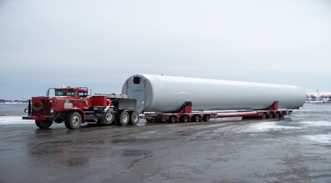 Truck hauling large tank