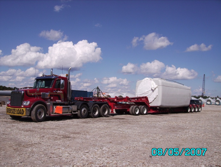 Truck hauling large container